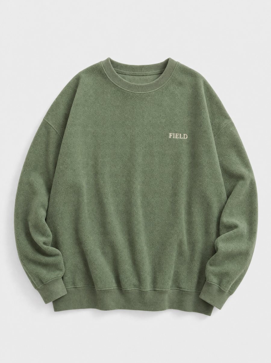 Flat product photo of a sage green FIELD crewneck